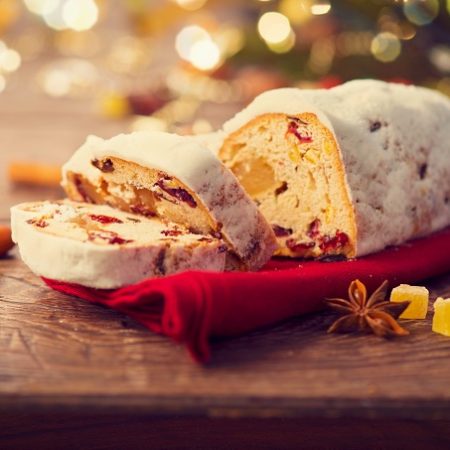 Christmas Stollen. Traditional Sweet Fruit Loaf with Icing Sugar