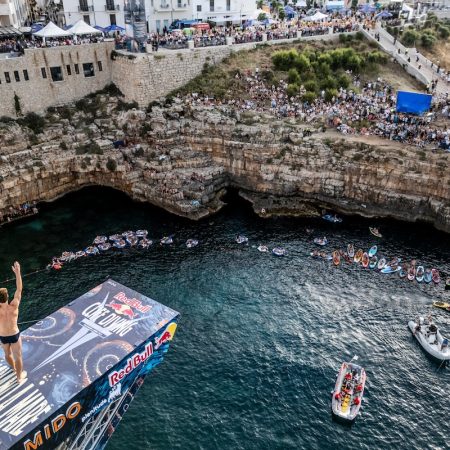 Andrea Barnaba of Italy acknowledges the crowd from the 27.5 metre platform during the final competition day of the third stop of the 2024 Red Bull Cliff Diving World Series in Polignano a Mare, Italy on June 30, 2024. // Dean Treml / Red Bull Content Pool // SI202406300744 // Usage for editorial use only //